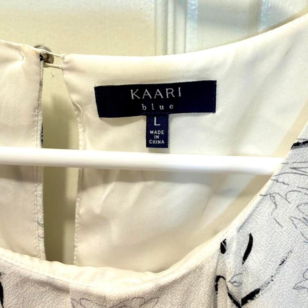 Kaari Blue Women's White Blouse with Black Abstract Swirls